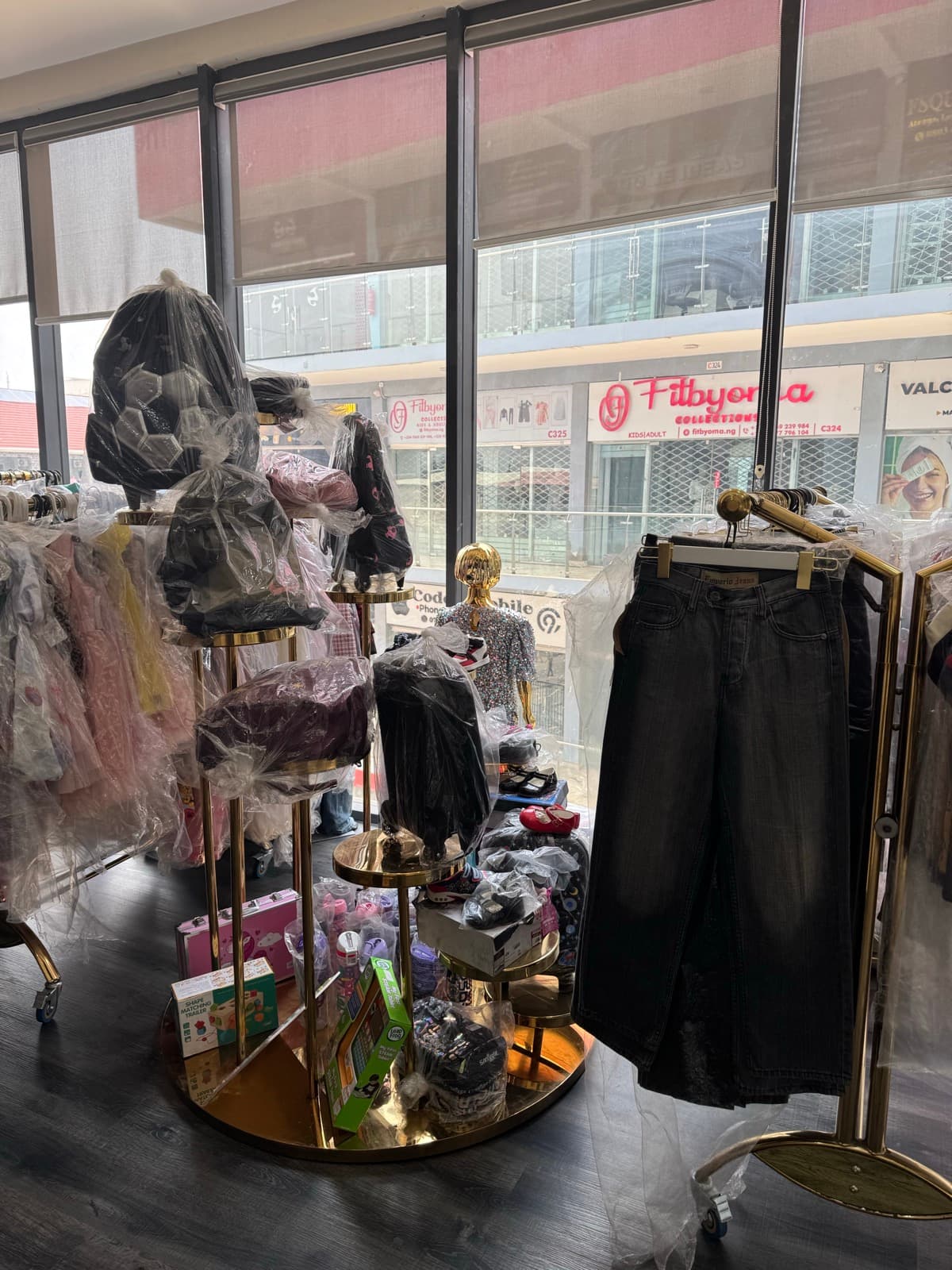 Theo Kiddies store section with neatly arranged baby and toddler clothing